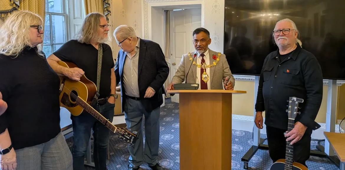 Councillor Hussain, the Mayor of Warrington welcomes Lost Hollow to the Town Hall